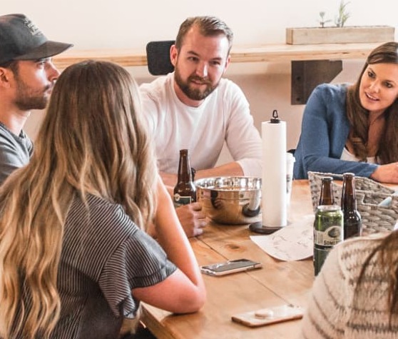 team discussing with snacks